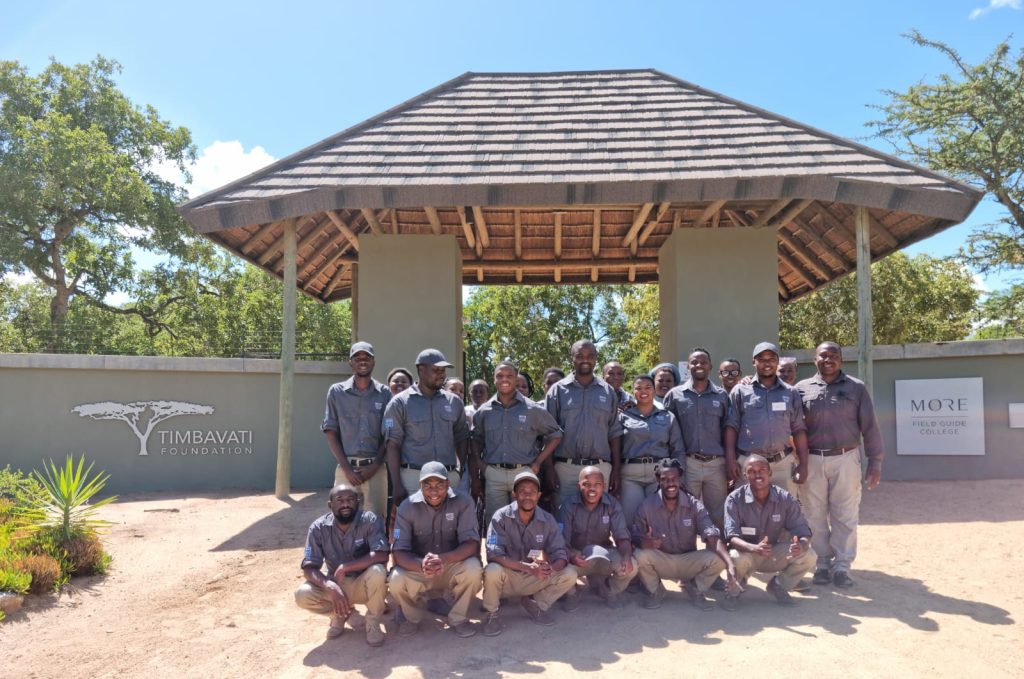 group-of-students-standing-in-front-of-entrance