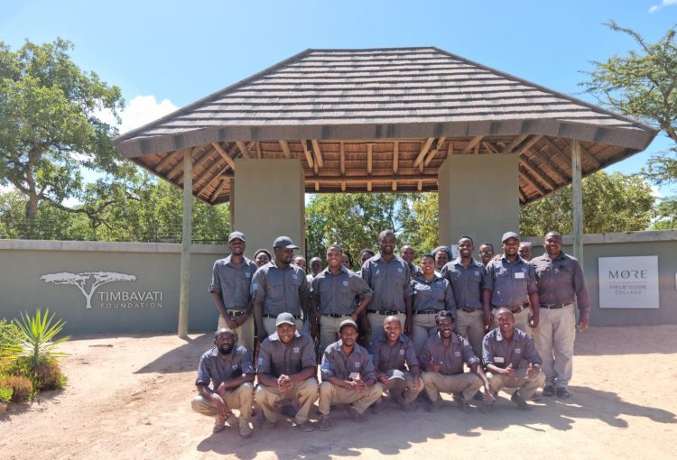 group-of-students-standing-in-front-of-entrance